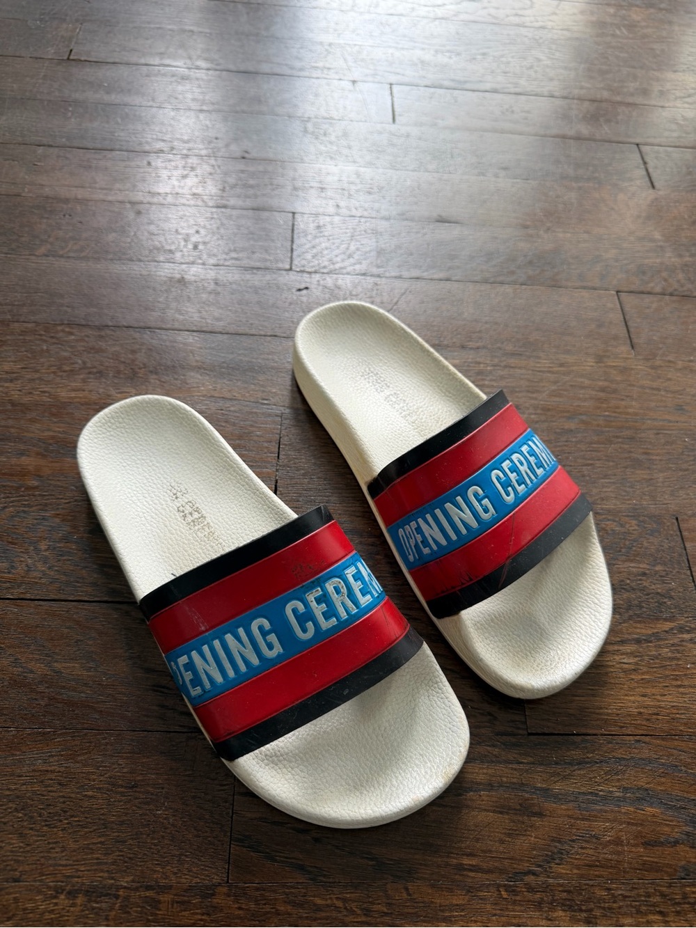 Opening Ceremony White Slides with Red, Blue & Black Straps